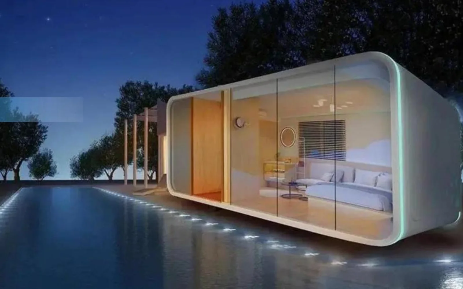 Night view through full-height glazing into a bedroom suite